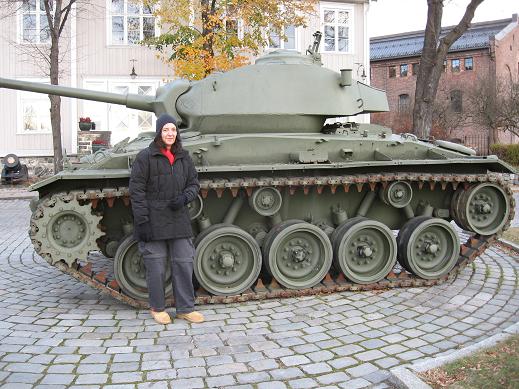 Cindy in front of tank in front of Armed Forces Museum